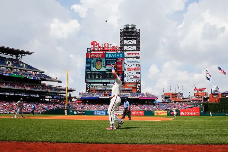 Phillies first baseman Rhys Hoskins waits to catch San Diego Padres third baseman Manny Machado's pop foul fly ball during the first-inning on Sunday, August 18, 2019 in Philadelphia.
