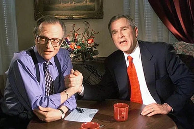 In this Dec. 16, 1999 file photo, Republican presidential candidate George W. Bush jokes with CNN's Larry King. After 25 years of "Larry King Live," King hung up his suspenders.  (AP Photo / John Russell)