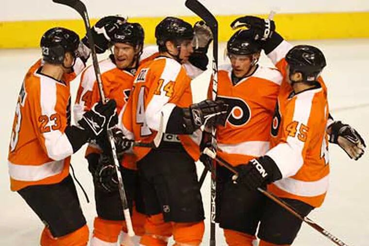 Flyers players celebrate a goal by Andreas Nodl in the second period of Tuesday's win over the Senators. (Michael S. Wirtz / Staff Photographer)