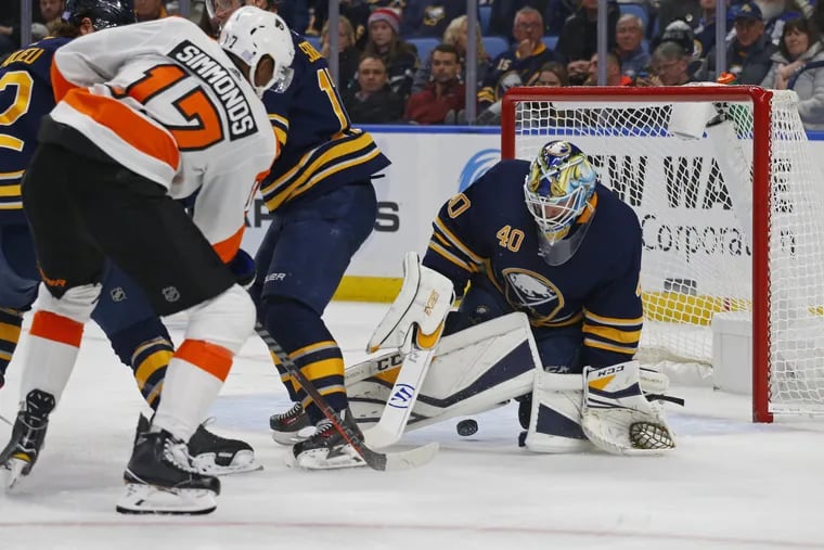 Flyers right winger  Wayne Simmonds puts the puck past Buffalo goalie Carter Hutton during the second period Wednesday. The Sabres won, 5-2.