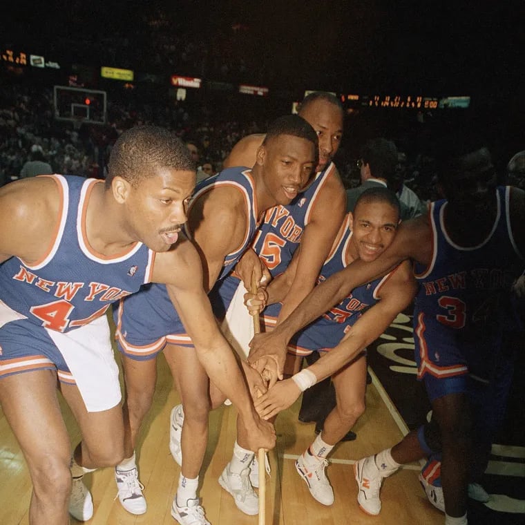 New York Knicks players Sidney Green, Trent Tucker, Eddie Lee Wilkins, Mark Jackson, and Charles Oakley after sweeping the 76ers in the 1989 Eastern Conference playoffs. This was the last time these two teams met in the playoffs.