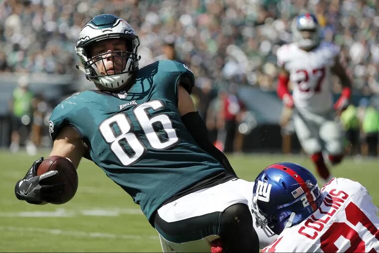 Eagles TE Zach Ertz is tackled by the Giants’ Landon Collins on Sunday.