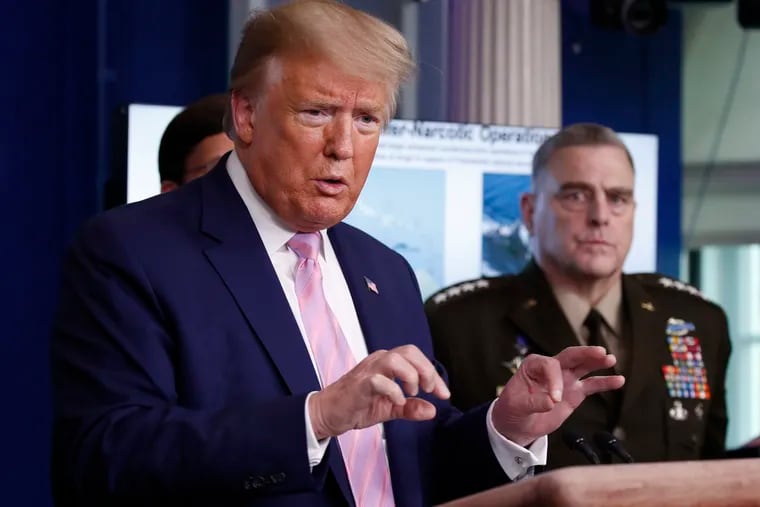 President Donald Trump speaks about the coronavirus in the James Brady Press Briefing Room of the White House, Wednesday, April 1, 2020, in Washington, as Chairman of the Joint Chiefs Gen. Mark Milley, listens. (AP Photo/Alex Brandon)