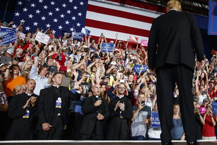 President Donald Trump turns to the cheering crowd as he arrives for a rally at the Four Seasons Arena at Montana ExpoPark in Great Falls, Montana, earlier this month.