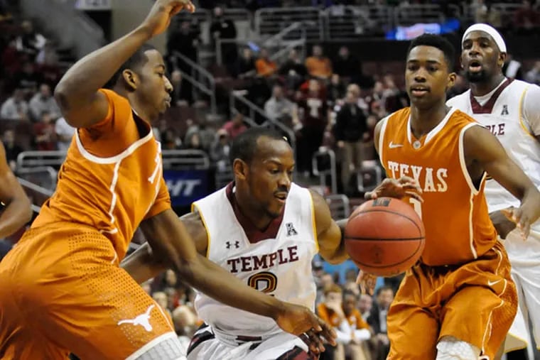 Temple's Demarcus Holland drives through Texas' defense in the second
period. (Ron Tarver/Staff Photographer)