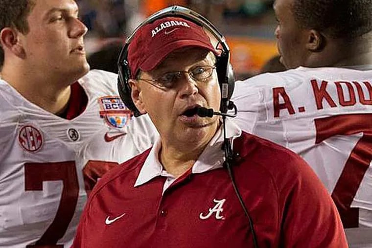 Alabama offensive line coach Jeff Stoutland, with his players during the national title game, is taking the same position with the Eagles. (AP, Cal
Sport Media)