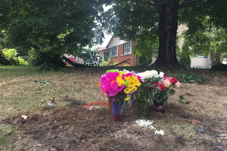 Family members gathered for a Monday vigil at the scene of the accident, Lake Road and West Boulevard. They placed flowers and crosses where the car had sat, flipped and crushed, the day prior.