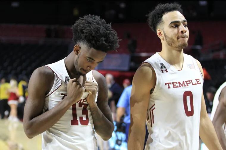 Temples Quinton Rose, left, and Obi Enechionyia walk off the court after their 87-67 loss to Villanova at the  Liacouras Center.