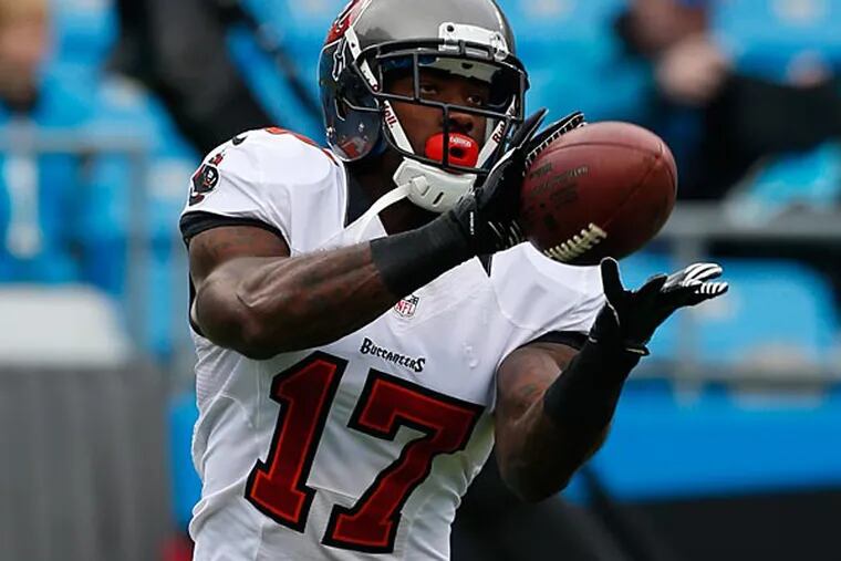Tampa Bay Buccaneers' Arrelious Benn (17) makes a catch during warm-ups before an NFL football game against the Carolina Panthers on Sunday, Nov. 18, 2012 in Charlotte, N.C. The Buccaneers won 27-21 in overtime. (AP Photo/Bob Leverone)