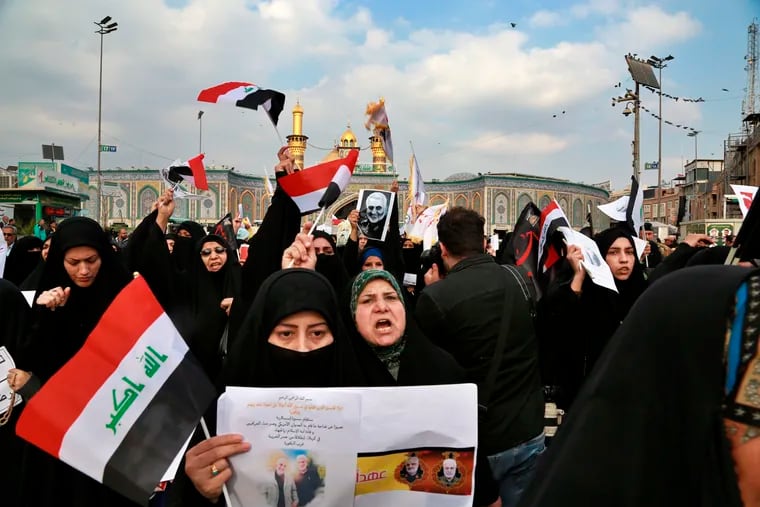 Shiite Muslims demonstrate over the U.S. airstrike that killed Iranian Revolutionary Guard Gen. Qassem Soleimani, in the posters, in Karbala, Iraq, Saturday, Jan. 4, 2020. Iran has vowed "harsh retaliation" for the U.S. airstrike near Baghdad's airport that killed Tehran's top general and the architect of its interventions across the Middle East, as tensions soared in the wake of the targeted killing.