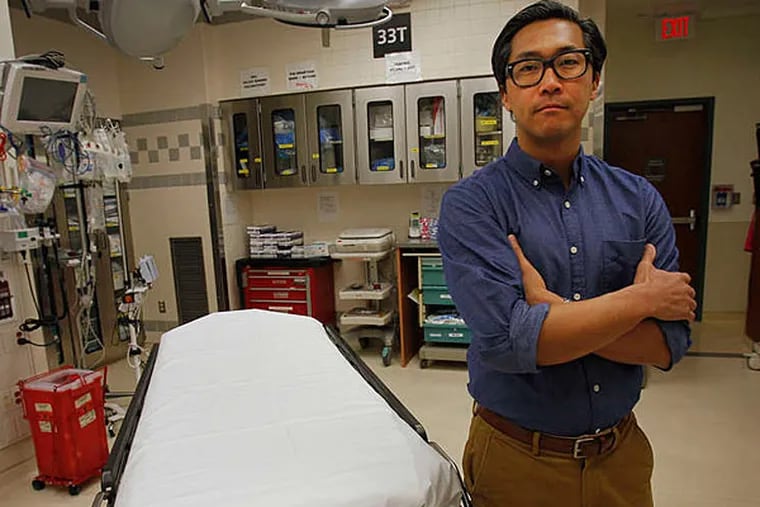 Dr. Bon Ku deals with scores of homeless patients in the Jefferson emergency room. (Alejandro A. Alvarez/Staff)