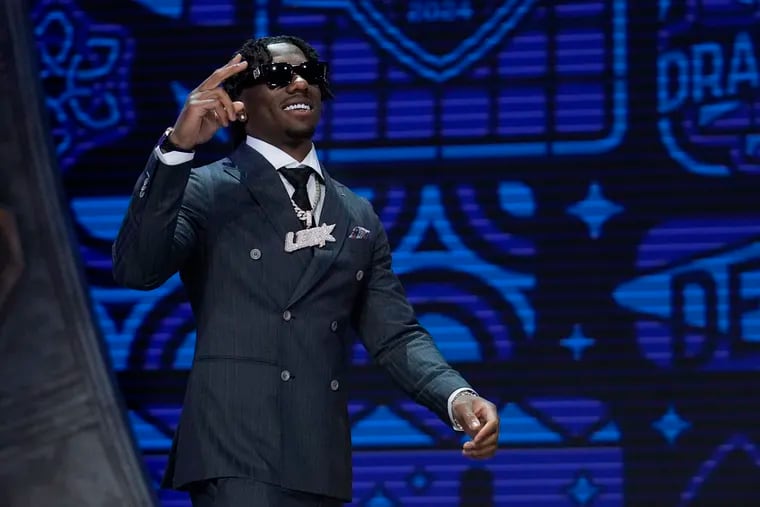 Toledo cornerback Quinyon Mitchell walks on stage during the first round of the NFL football draft, Thursday, April 25, 2024, in Detroit. (AP Photo/Jeff Roberson)