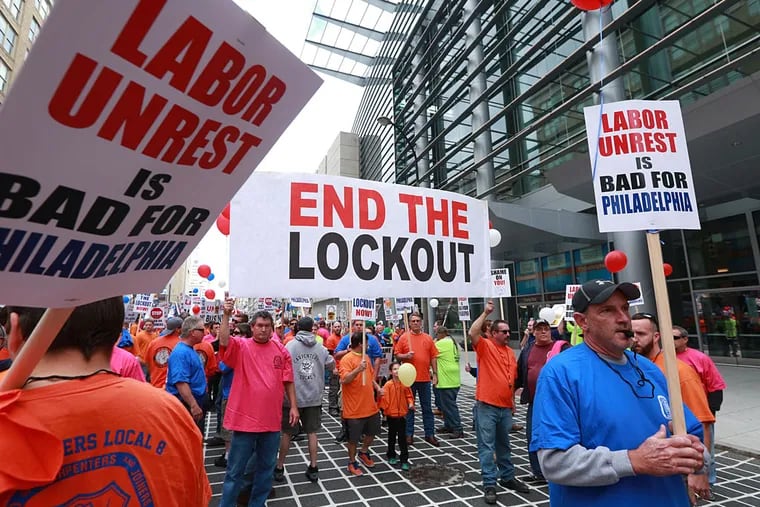 Carpenters protest in front of the Convention Center on North Broad Street last fall. DAVID SWANSON / Staff Photographer