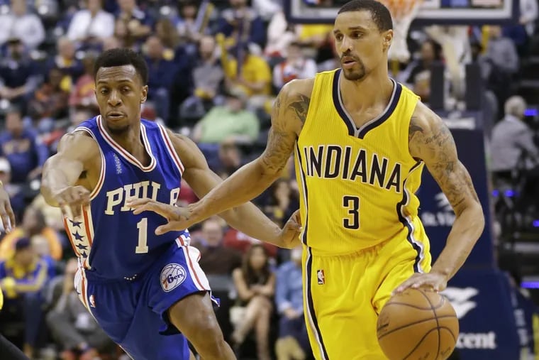 Pacers' George Hill  drives on Sixers'  Ish Smith in second half of Monday night's game.