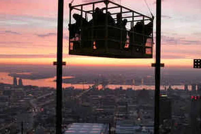 Iron workers began another day of work on the Comcast Center at sunrise in March 2007, being hoisted to the 51st floor. By 2029, what we think of as Center City may extend to the Penn and Temple campuses.