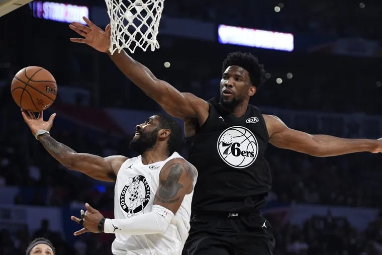 Joel Embiid goes for the block against Team LeBron player Kyrie Irving. Embiid, who was a starter for Team Stephen, had a strong first half.