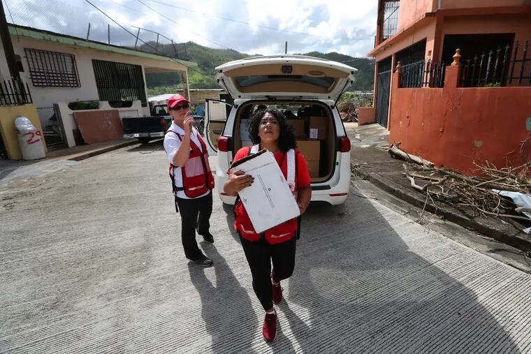 Quetcy Lozada, Philadelphia, spends her last day of two weeks as a volunteer for the Salvation Army delivering water in Cayey, Puerto Rico, Tuesday October 31, 2017.