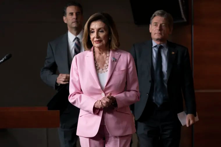 Speaker of the House Nancy Pelosi, D-Calif., joined by Rep. John Sarbanes, D-Md., left, and Rep. Tom Malinowski, D-N.J., leads House Democrats to discuss H.R. 1, The For the People Act, which passed in the House but is being held up in the Senate, at the Capitol in Washington, Friday, Sept. 27, 2019.