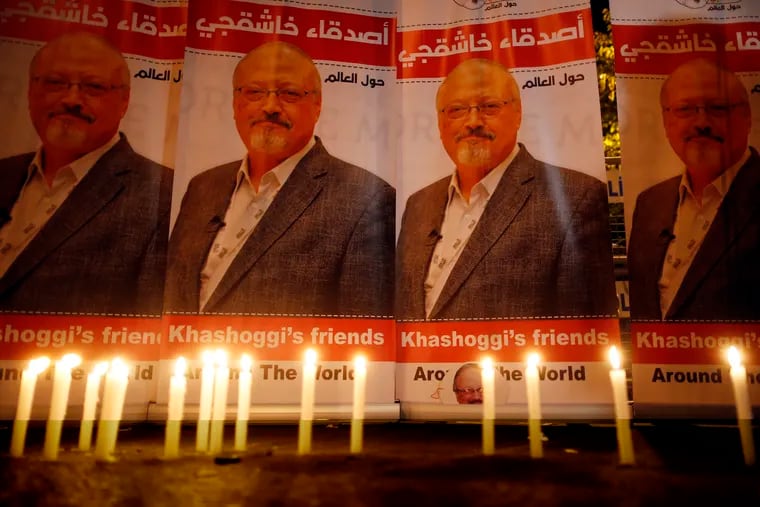 FILE – In this Oct. 25, 2018, file photo, candles, lit by activists, protesting the killing of Saudi journalist Jamal Khashoggi, are placed outside Saudi Arabia's consulate, in Istanbul, during a candlelight vigil.