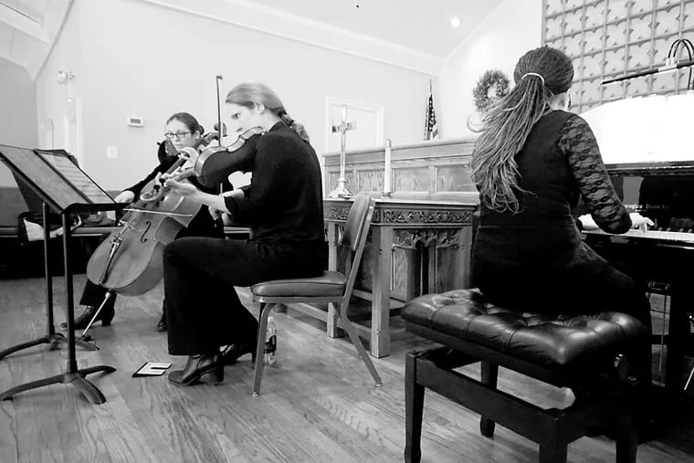 The Musicalia Ensemble at St. John's Presbyterian Church. Members are Iris Blanco-Urgelles on piano, Cassia Harvey on cello, and her sister Myanna Harvey on violin.