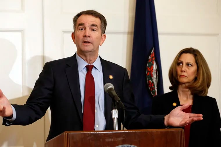 In this Feb. 2, 2019, photo, Virginia Gov. Ralph Northam, left, accompanied by his wife, Pam, speaks during a news conference in the governor's mansion in Richmond, Va. Democrats are hoping thereâ€™s a silver lining to the Northam mess - that it shows they wonâ€™t tolerate racism. Every level of the party has condemned the Democratic Virginia governor and demanded he step down. That follows disclosure that his medical school yearbook page features photos of a man in blackface standing with someone dressed in Klu Klux Klan attire.