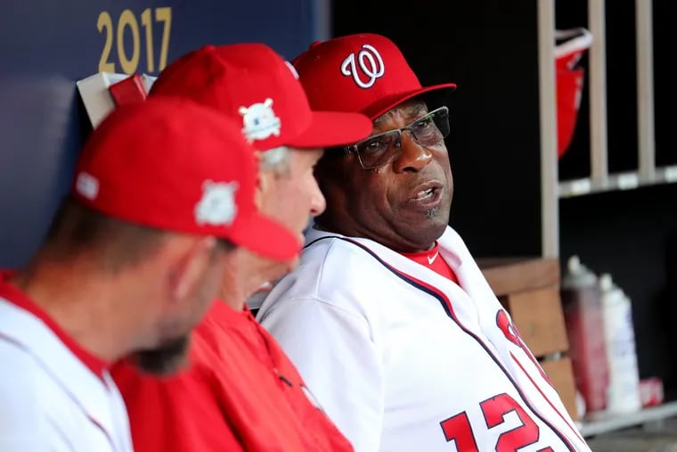 Then-Nationals manager Dusty Baker (12) in the dugout before Game 2 of the National League Division Series against the Chicago Cubs in October 2017.