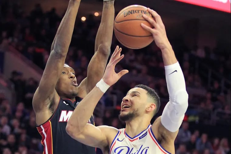 Ben Simmons, right, of the Sixers shoots over Josh Richardson of the Heat during the 1st half of their game at the Wells Fargo Center on Feb. 2, 2018.