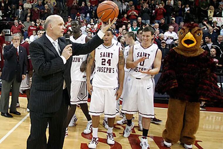 "I hope for 310 more," Phil Martelli said after setting a new St. Joe's record for wins by a head coach. (Yong Kim/Staff Photographer)