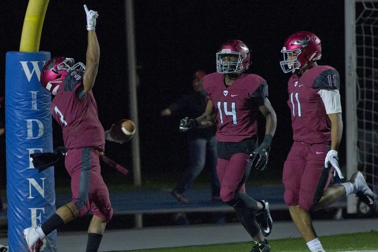 St. Joseph's Prep's Marques Mason (left) celebrates his 90-yard touchdown return in a 49-12 win over Catholic League Red Division rival La Salle on Sept. 28.