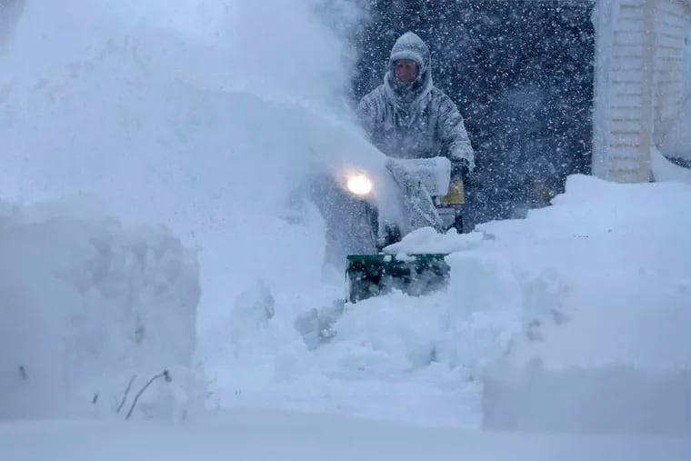 A snowblower roars into action in a driveway in Depew, N.Y., after several feet of snow paralyzed the Buffalo area in a November a few years back.