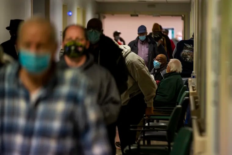 Veterans surrounding area and New Jersey fill the halls of the Philadelphia VA Medical Center to receive the COVID-19 vaccine on Saturday, Jan. 23, 2021.