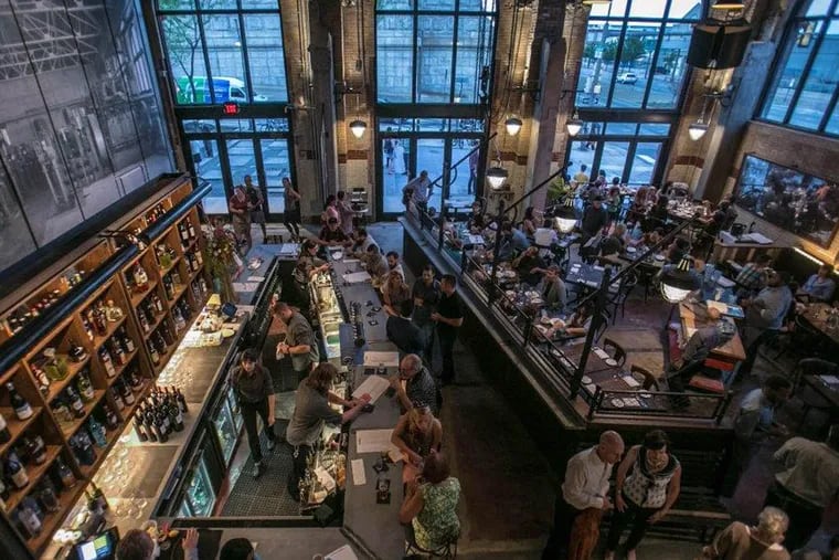 La Peg's bar (left) and dining room, as viewed from the mezzanine. (Kevin Monko)
