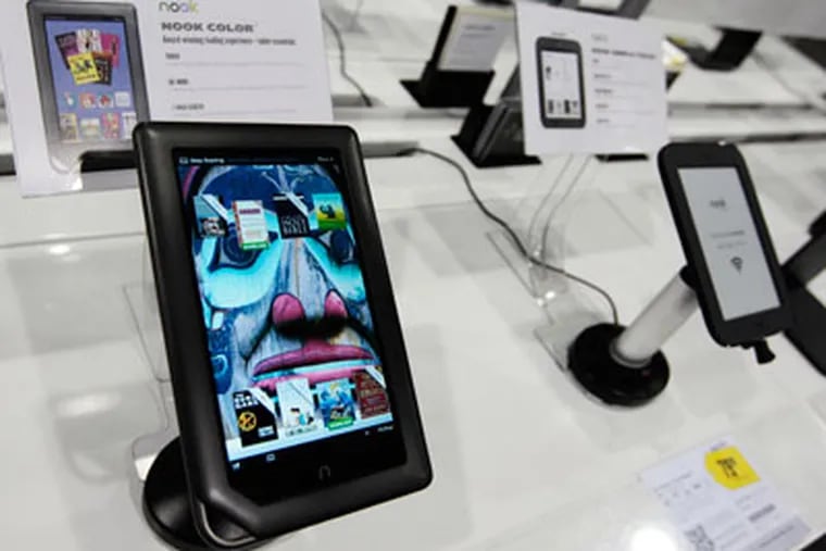 A Barnes & Noble Nook Color eReader, left, is shown next to a Nook Simple Touch eReader, right, on display at a Best Buy in Mountain View, Calif., Monday, April 30, 2012. An infusion of money from Microsoft Corp. sent Barnes & Noble Inc.'s stock zooming Monday, as the software giant established a way to get back into the e-books business. The two companies are teaming up to create a subsidiary for Barnes & Noble's e-book and college textbook businesses, with Microsoft paying $300 million for a minority stake. (AP Photo/Paul Sakuma)