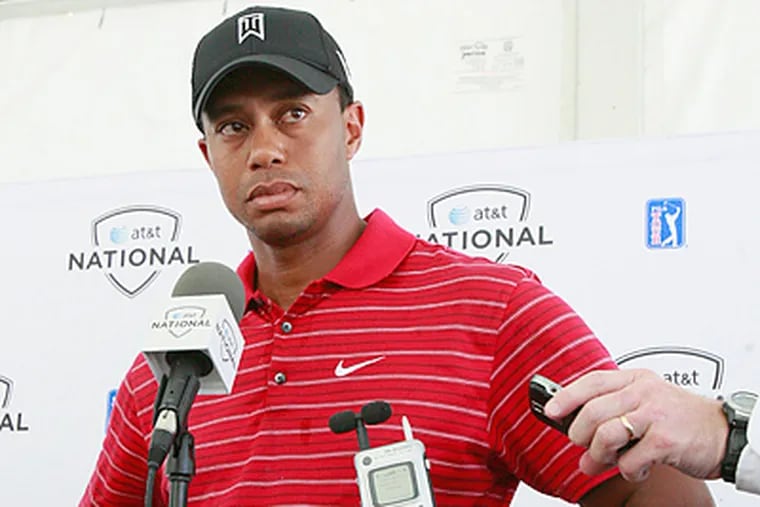 Tiger Woods answers questions from reporters immediately after his final round. (Elizabeth Robertson / Staff Photographer)