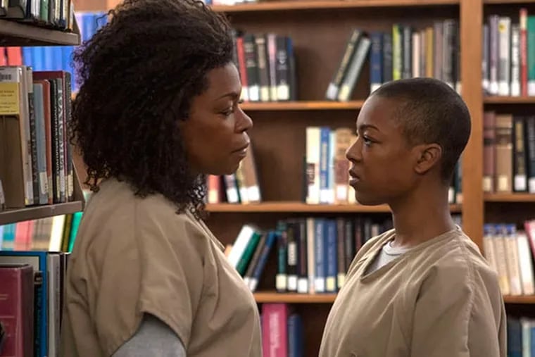 Lorraine Toussaint (L) and Samira Wiley (R) in a scene from Netflix's "Orange is the New Black" Season 2, premiering Friday, June 6. (Linda Kallerus for Netflix.)