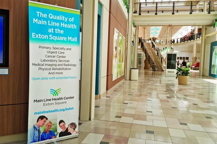 Signage for Main Line Health Center in lower level of Exton Square Mall.