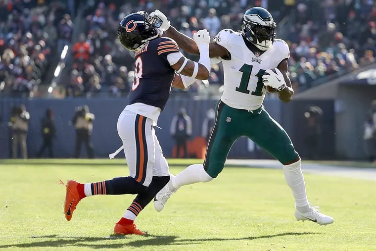 Eagles wide receiver A.J. Brown stiff-arms Bears safety Jaquan Brisker after a reception in the second quarter Sunday.