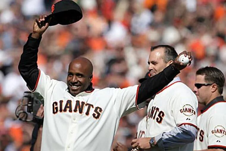 Barry Bonds threw out the first pitch for Game 3 of the NLCS - the first NLCS game the Giants had hosted since 2002. (Yong Kim / Staff Photographer)