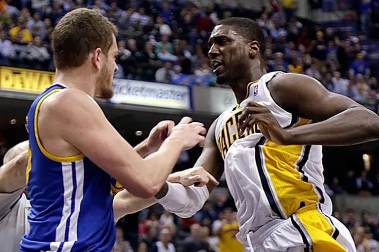 Indiana Pacers center Roy Hibbert skirmishes with Golden State Warriors forward David Lee during the second half. (AJ Mast/AP)