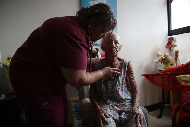 Dr. Sandra Alvarez gives Mercedes Perez a health care checkup in her apartment at the Pedro America Pagan de Colon assisted living faclity in San Juan in the aftermath of Hurricane Maria.