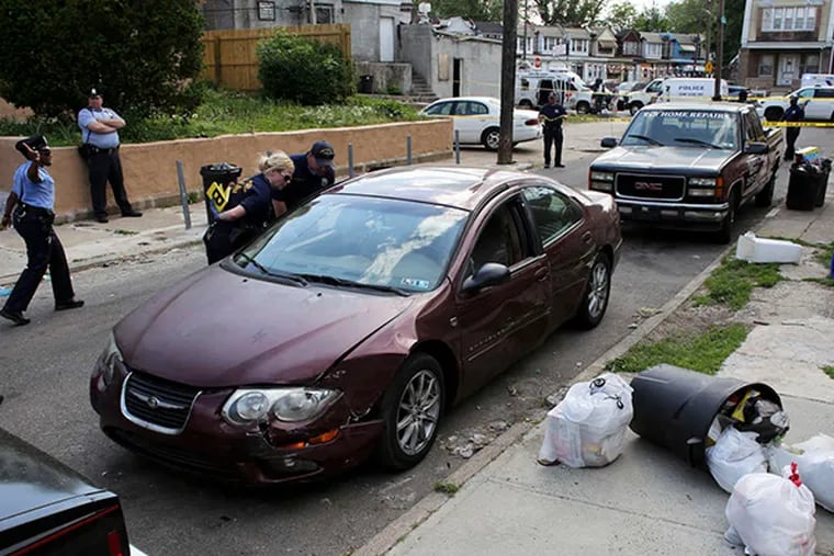 Police examining Rudolph Keitt's car in May.