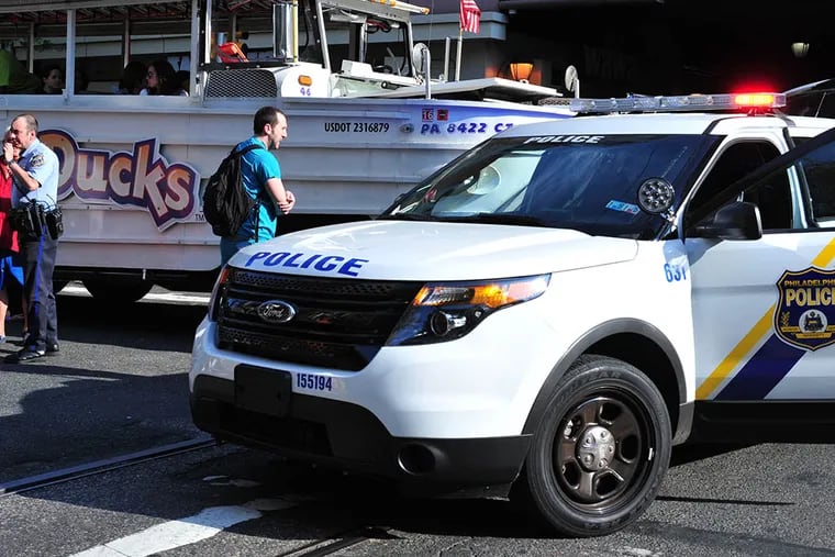 Police investigating an accident in which a woman was struck by a duck boat near the Pennsylvania Convention Center on May 8, 2015. ( Jessie Fox / Philly.com )