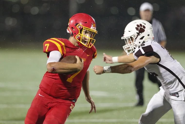 Jake Ruane, left, of Haverford tries to get away from Brandon DiCamillo of Garnet Valley during the 1s quarter at Haverford High on Sept. 7, 2018.