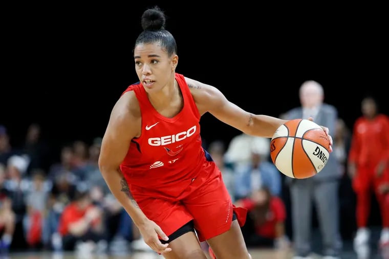 FILE - In this Sept. 24, 2019 file photo, Washington Mystics' Natasha Cloud drives up the court against the Las Vegas Aces during the second half of Game 4 of a WNBA playoff basketball in Las Vegas.  Cloud and her WNBA colleagues continue to be active in the fight against social injustice and police brutality, participating in protests and continuing work that they began four years ago. (AP Photo/John Locher, File)
