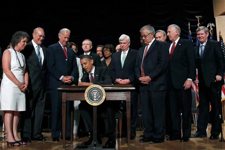 President Barack Obama signs the Dodd Frank legislation in July 2010.