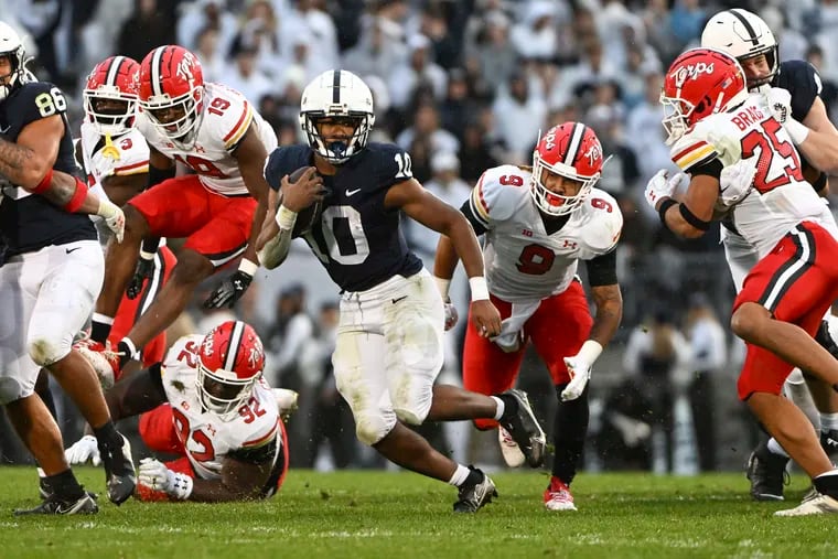 Penn State running back Nicholas Singleton scores a touchdown against Maryland in the first half.