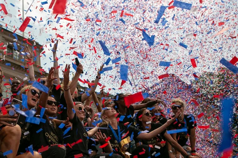Megan Rapinoe and her U.S. women's soccer team colleagues bask in a confetti shower at the end of the parade and celebration in their honor in New York.