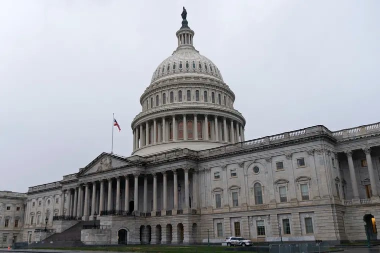 The U.S. Capitol is seen in Washington. Unemployment insurance aid is expiring for millions on the weekend as President Donald Trump holds a pandemic-relief package in limbo and gripes about “pork” in the bipartisan legislation passed by Congress.