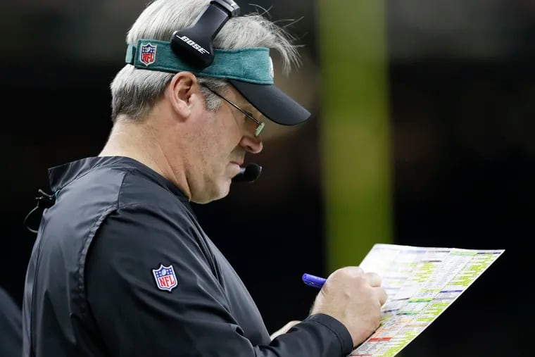 Eagles Head Coach Doug Pederson looking at his play chart against the New Orleans Saints in a NFC Divisional playoff game on Sunday, January 13, 2019 in New Orleans.