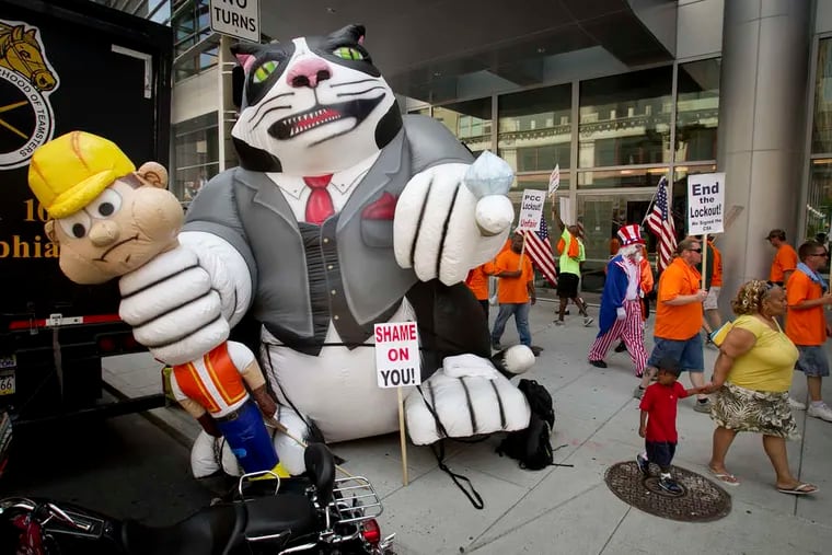 Using an inflatable "fat cat," carpenters protested outside the Convention Center on July 11, 2014. Earlier that year, John Dougherty and his electricians union crossed the carpenters' picket line.